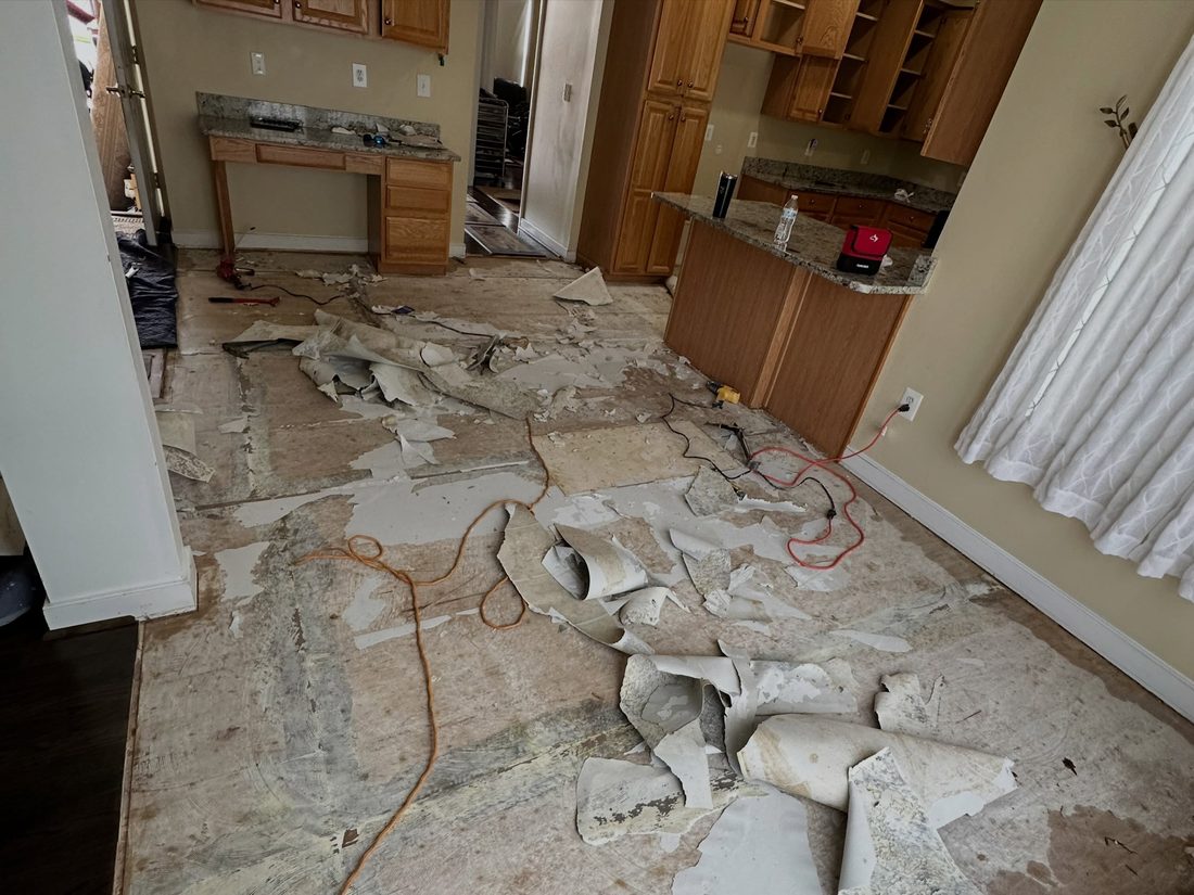 Old tile lifted, subfloor exposed